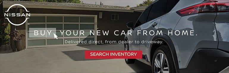 Nissan vehicle parked outside a house