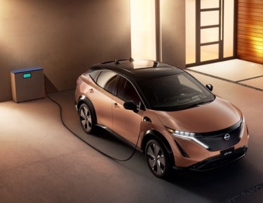 Nissan ARIYA plugged-in and charging outside a home | Dutch Miller of Wytheville in Wytheville VA